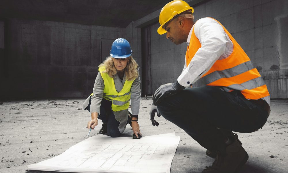 Construction industry and engineering - engineers, architects and contractors on the construction si